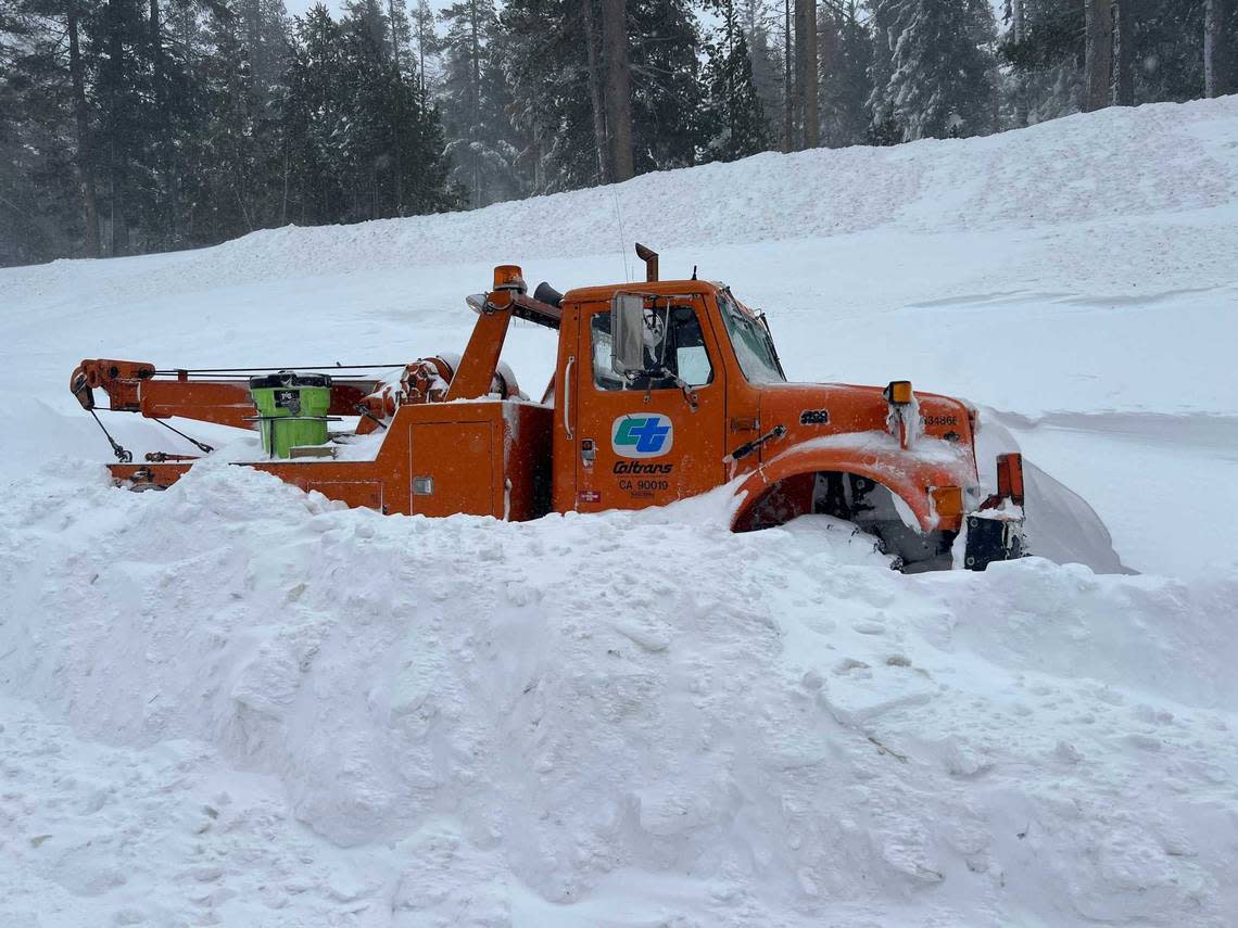 A Caltrans tow truck is surrounded by snow along a closed Interstate 80 near Donner Pass on Saturday, March 2, 2024, after authorities shut down the major freeway due to whiteout conditions. A blizzard that was raking over the Sierra is expected to dump as much as 12 feet of snow on the region by the end of Sunday. Caltrans District 3