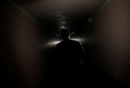 Devendran, a 55-year-old observer, walks out of the solar tunnel telescope at the Kodaikanal Solar Observatory, India, February 5, 2017. REUTERS/Danish Siddiqui