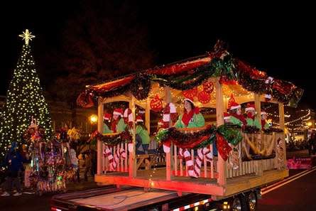 A float makes its way down Main Street during a previous Uptown Lexington Christmas Parade. The parade will take place at 6 p.m. Dec. 6, after being canceled in 2020 due to the pandemic.