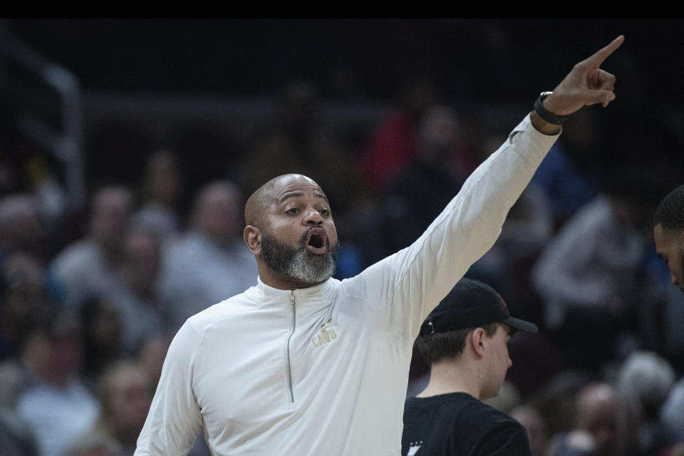 Cleveland Cavaliers head coach J.B. Bickerstaff signals to his team during the first half of an NBA basketball game against the Charlotte Hornets in Cleveland, Sunday, April 9, 2023. (AP Photo/Phil Long)