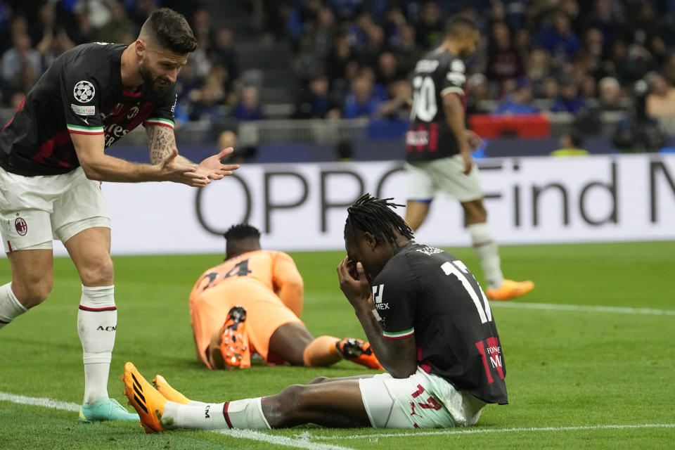 AC Milan's Olivier Giroud, left as his teammate Rafael Leao, right, reacts after a missed scoring opportunity during the Champions League semifinal second leg soccer match between Inter Milan and AC Milan at the San Siro stadium in Milan, Italy, Tuesday, May 16, 2023. (AP Photo/Luca Bruno)