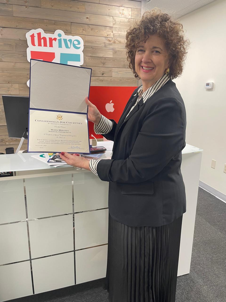 Maria Miranda, owner of Miranda Creative, was honored Monday for winning the SBA Small Business Person of the Year Award for Connecticut. She holds a Certificate of Special Congressional Recognition from U.S. Rep. Joe Courtney.