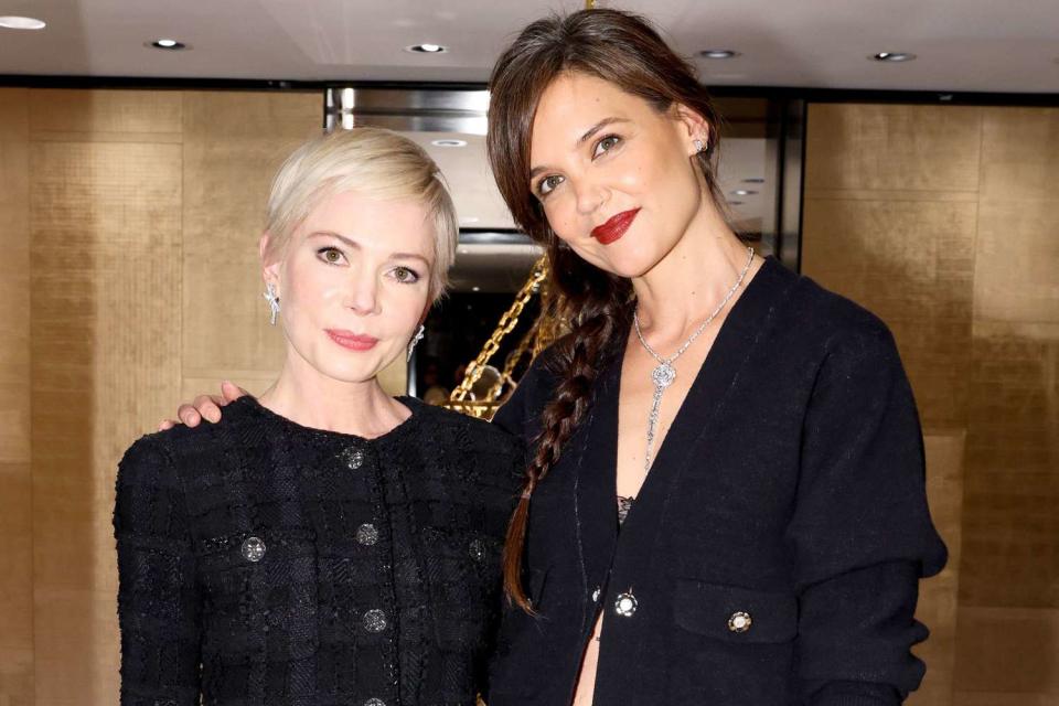 <p>Matteo Prandoni/BFA.com/Shutterstock</p> Michelle Williams and Katie Holmes at Chanel event