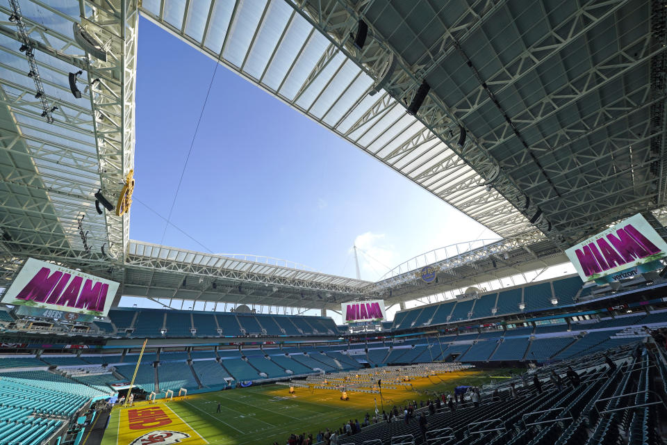 Grow lights cover a portion of the grass field inside Hard Rock Stadium Tuesday, Jan. 28, 2020, in Miami Gardens, Fla., in preparation for the NFL Super Bowl 54 football game. (AP Photo/David J. Phillip)