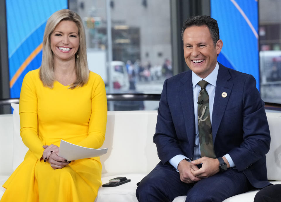 FILE - Ainsley Earhardt, left, and Brian Kilmeade appear on "Fox & Friends" in New York on Nov. 11, 2022. At conservative America's favorite news source, the Republican nomination process is essentially over and has been for awhile, leaving Ron DeSantis and Nikki Haley annoyed at perceived favoritism to Trump. (Photo by Charles Sykes/Invision/AP, File)