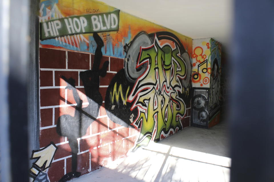 A mural painted on a wall of the building at 1520 Sedgwick Ave, known as the "birthplace of hip-hop," is barred off in the Bronx section of New York ahead of the 50th anniversary of hip-hop, Monday, July 24, 2023. Hip-hop rose from the ashes of a borough ablaze with poverty, urban decay and gang violence. From breaking to graffiti “writing” to MC-ing or rapping, the block parties and various elements of hip-hop served as an outlet for creativity and an escape from the hardships of daily life. (AP Photo/Noreen Nasir)