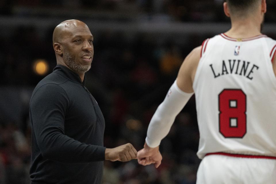 Portland Trail Blazers head coach Chauncey Billups, left, fist-bumps Chicago Bulls guard Zach LaVine during the first half of an NBA basketball game Saturday, Feb. 4, 2023, in Chicago. (AP Photo/Erin Hooley)