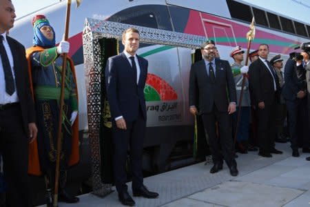 French President Emmanuel Macron and Moroccan King Mohammed VI pose for a photograph as they inaugurate a high-speed line at Rabat train station, in Rabat, France November 15, 2018. Christophe Archambault/Pool via Reuters