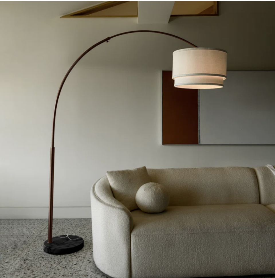 a lamp next to a couch