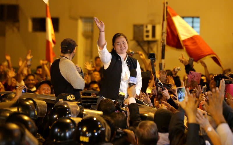 Peru's opposition leader Keiko Fujimori waves after being released from the Santa Monica prison, in Lima