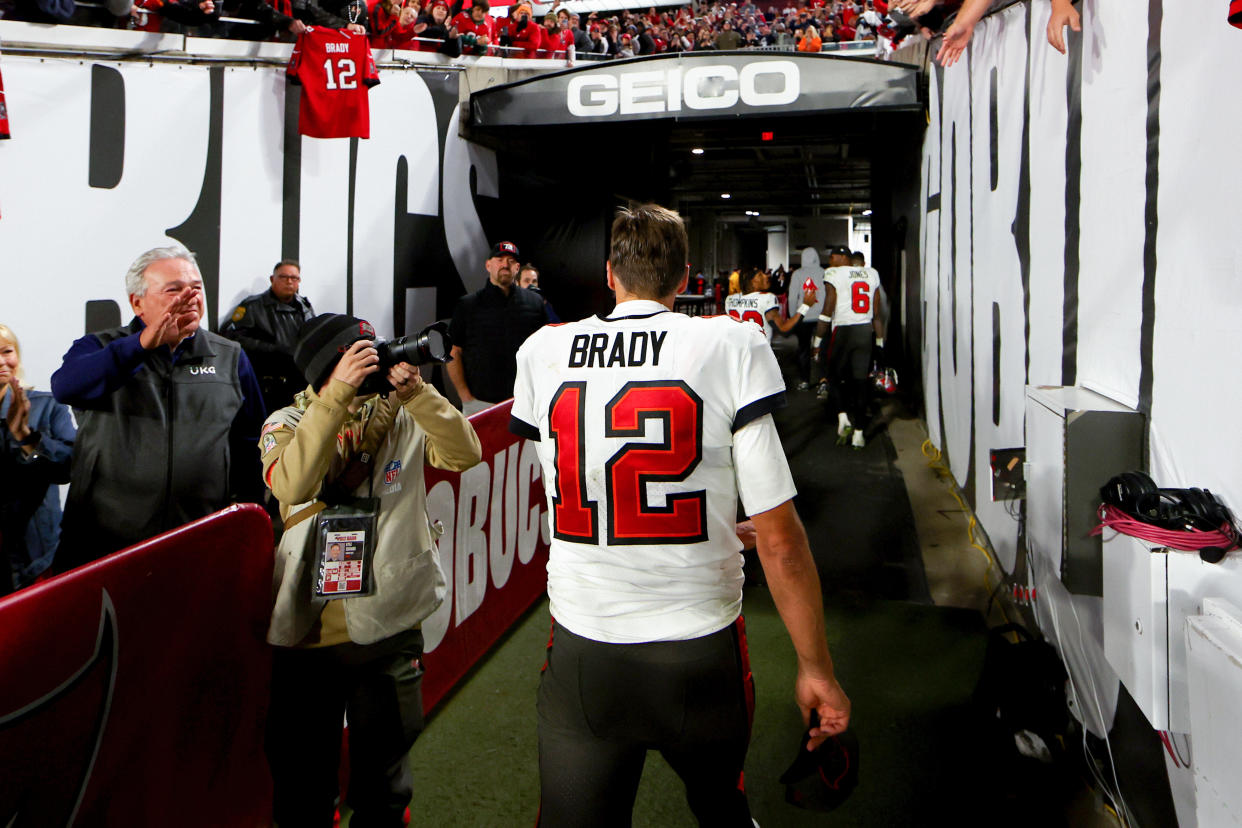 Tom Brady walks off the field after losing to the Dallas Cowboys 31-14 in the NFC wild-card game on Jan. 16 in Tampa, Florida. It would be his final game. (Mike Ehrmann/Getty Images)