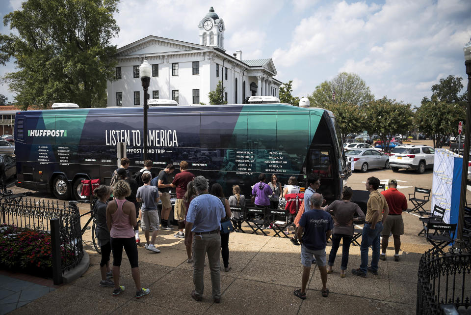 People surround the HuffPost tour bus during the visit to Oxford, Mississippi.