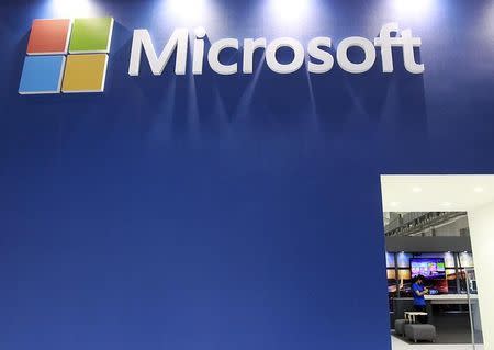 A employee stands in the Microsoft booth during the 2014 Computex exhibition at the TWTC Nangang exhibition hall in Taipei June 3, 2014. REUTERS/Pichi Chuang