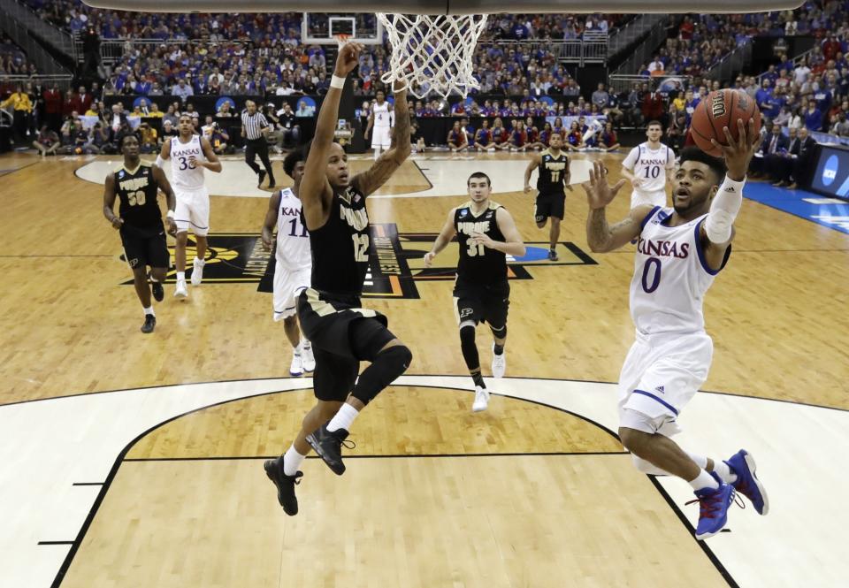 Kansas G Frank Mason scored 26 points on 9-11 shooting. (AP)