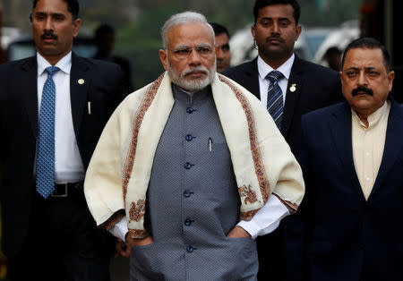 FILE PHOTO - Prime Minister Narendra Modi walks to speak with the media as he arrives at the parliament house to attend the first day of the budget session, in New Delhi, India, January 31, 2017. REUTERS/Adnan Abidi/File Photo