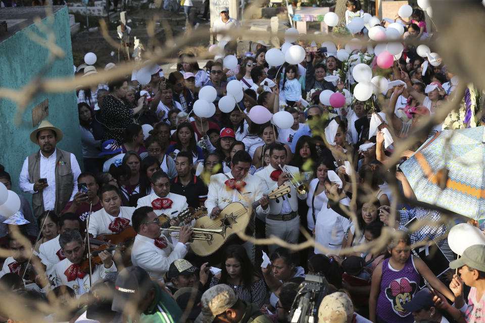 A Mariachi band plays during the funeral of 7-year-old murder victim Fatima in Mexico City, Tuesday, Feb. 18, 2020. Fatima's body was found wrapped in a bag and abandoned in a rural area on Saturday. Five people have been questioned in the case, and video footage of her abduction exists. (AP Photo/Marco Ugarte)