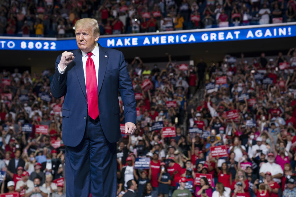 President Donald Trump arrives on stage to speak at a campaign rally at the BOK Center, Saturday, June 20, 2020, in Tulsa, Okla. Trump is asking Americans to let him keep his job. His critics are asking how much of that job he’s actually doing. Those questions have gotten louder in recent days following revelations that Trump didn’t read at least two written intelligence briefings detailing concerns that Russia was paying bounties to the Taliban for the deaths of Americans in Afghanistan. (AP Photo/Evan Vucci)