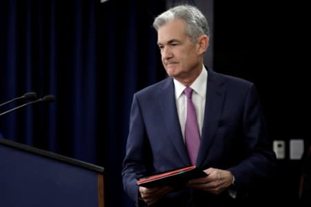 FILE PHOTO: Federal Reserve Board Chairman Jerome Powell arrives at his news conference after the two-day meeting of the Federal Open Market Committee (FOMC) on interest rate policy in Washington, U.S., June 13, 2018. REUTERS/Yuri Gripas/File Photo