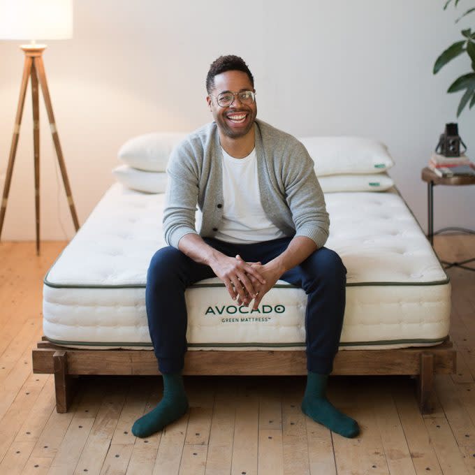 young man sitting on top of Avocado Green Mattress