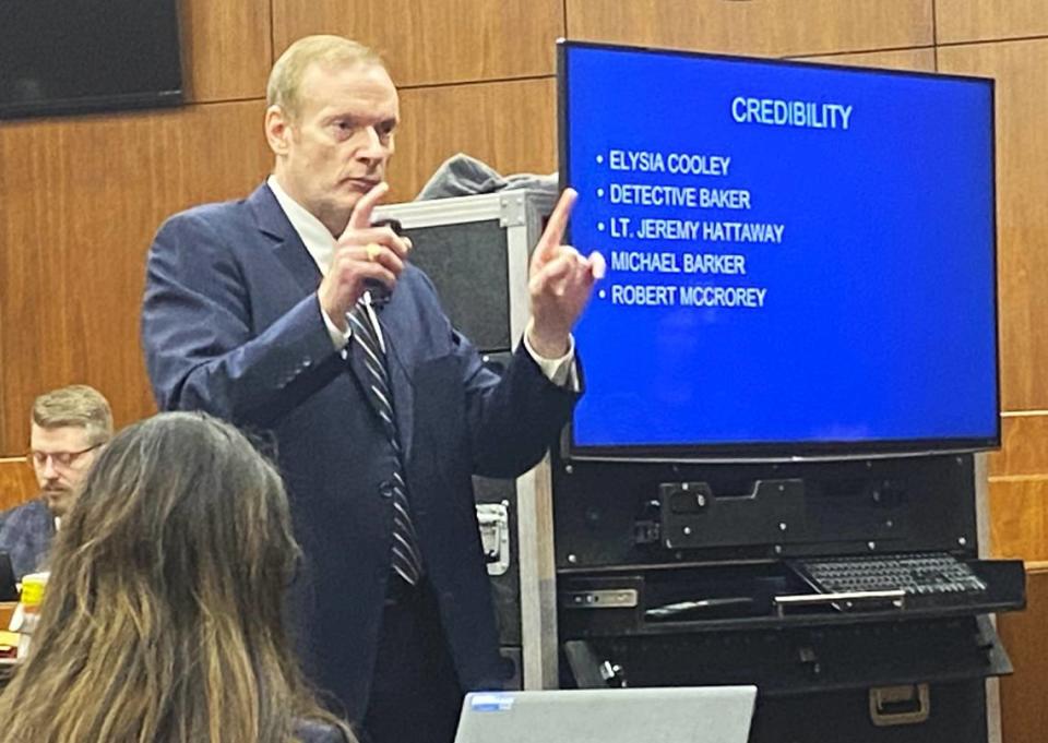 Thomas Kegley, a gang prosecutor for the Georgia attorney general, makes his closing argument with a list of trial witnesses on the screen beside him.