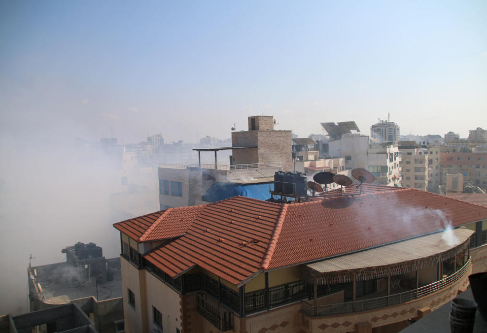 Smoke fills the air Wednesday after Israeli aircraft bombed the area west of Gaza City. (Ahmad Hasaballah / Getty Images)