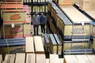 Co-founders Reza Farsi and Mehdi Farsi stand for a portrait in their warehouse at State Bicycle in Tempe