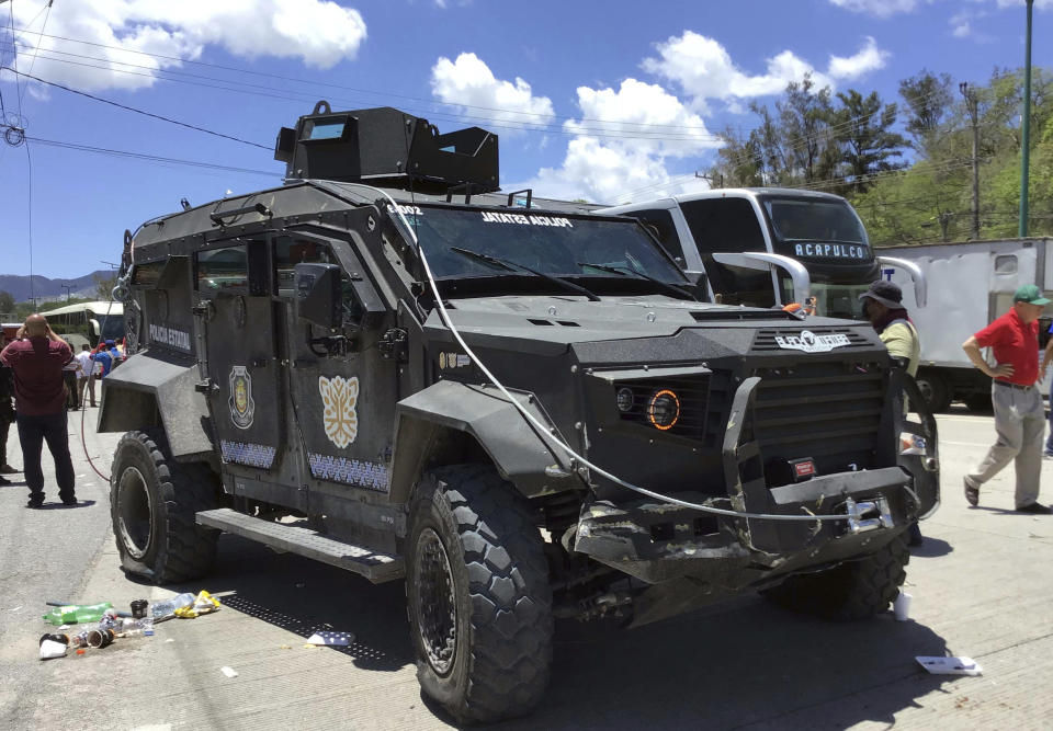 An armored vehicle belonging to the State of Guerrero police that was seized by demonstrators during a protest on Monday, is returned to authorities in Chilpancingo, Mexico, Tuesday, July 11, 2023. According to officials the large demonstration that blocked the main highway and abducted several officials was organized by a drug gang aiming to force the government´s release of two detained gang leaders who have been charged with drug and weapons possession. (AP Photo/Alejandrino Gonzalez)