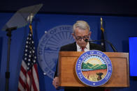 Ohio Gov. Mike DeWine pauses as he speaks during a news conference, Friday, Dec. 29, 2023, in Columbus, Ohio. DeWine vetoed a measure Friday that would have banned gender-affirming care for minors and transgender athletes’ participation in girls and women’s sports, in a break from members of his party who championed the legislation. (AP Photo/Carolyn Kaster)