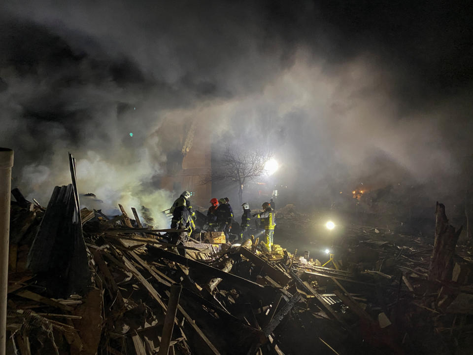 Rescuers work at the site of a residential building destroyed by a Russian missile strike, amid Russia's attack on Ukraine, in Kharkiv, Ukraine August 17, 2022.  REUTERS/Vitalii Hnidyi