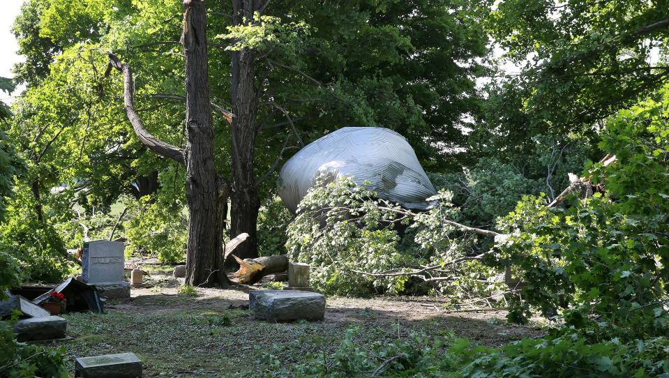 In this June 2015 file photo, a grain bin from a nearby farm was blown into the adjacent South Farmington Friends Cemetery after a confirmed tornado touched down in Farmington.