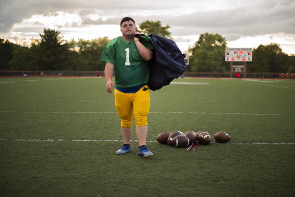 Former Hocking College football player Caden Cox has sued the college, its president and several current and former college employees, alleging disability discrimination, retaliation and assault. In this file photo, Cox unloads practice footballs at Nelsonville-York High School on Oct. 6, 2021.