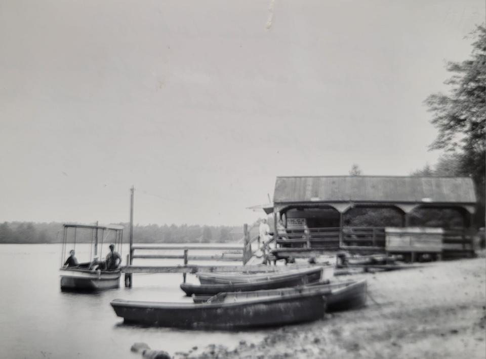 The wharf at Sabbatia Lake in 1897. The back of the photo reads, "About 1899 they had a fine naphtha launch ... with large smokestack."