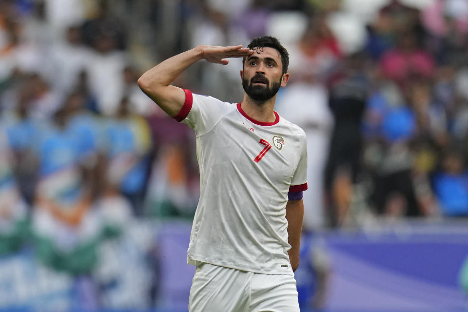 Syria's Omar Khrbin celebrates after scoring the opening goal during the Asian Cup Group B soccer match between Syria and India at Al Bayt Stadium in Al Khor, Qatar, Tuesday, Jan. 23, 2024. (AP Photo/Aijaz Rahi)