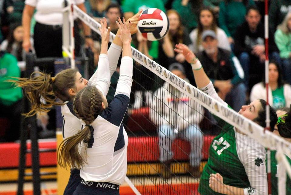 P-O’s Ava Ropert blocks the shot of Trinity’s Melissa Zack (27) with help from P-O’s Emily Gustkey. The Philipsburg-Osceola girls volleyball team won the PIAA Class 2A state championship Saturday at Cumberland Valley in Mechanicsburg. P-O defeated Trinity 3-1.