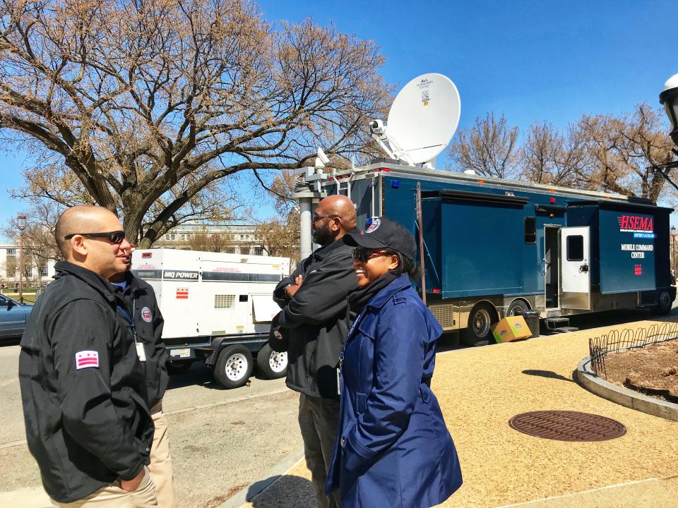 Chris Rodriguez, director of the D.C. Homeland Security and Emergency Management Agency, talks to members of his staff outside the agency’s Mobile Command Unit stationed near the National Mall during the March for Our Lives in D.C. on March 24, 2018. (Photo: Caitlin Dickson/Yahoo News)