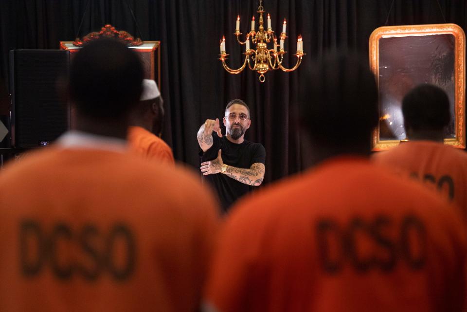 Nathan Lee, founder of Send Musicians to Prison, speaks to the crowd of inmates before Blessing Offor, a two-time Grammy nominee, performs during the Send Musicians to Prison event at the Metro Detention Facility in Nashville, Tenn., Monday, Nov. 6, 2023.