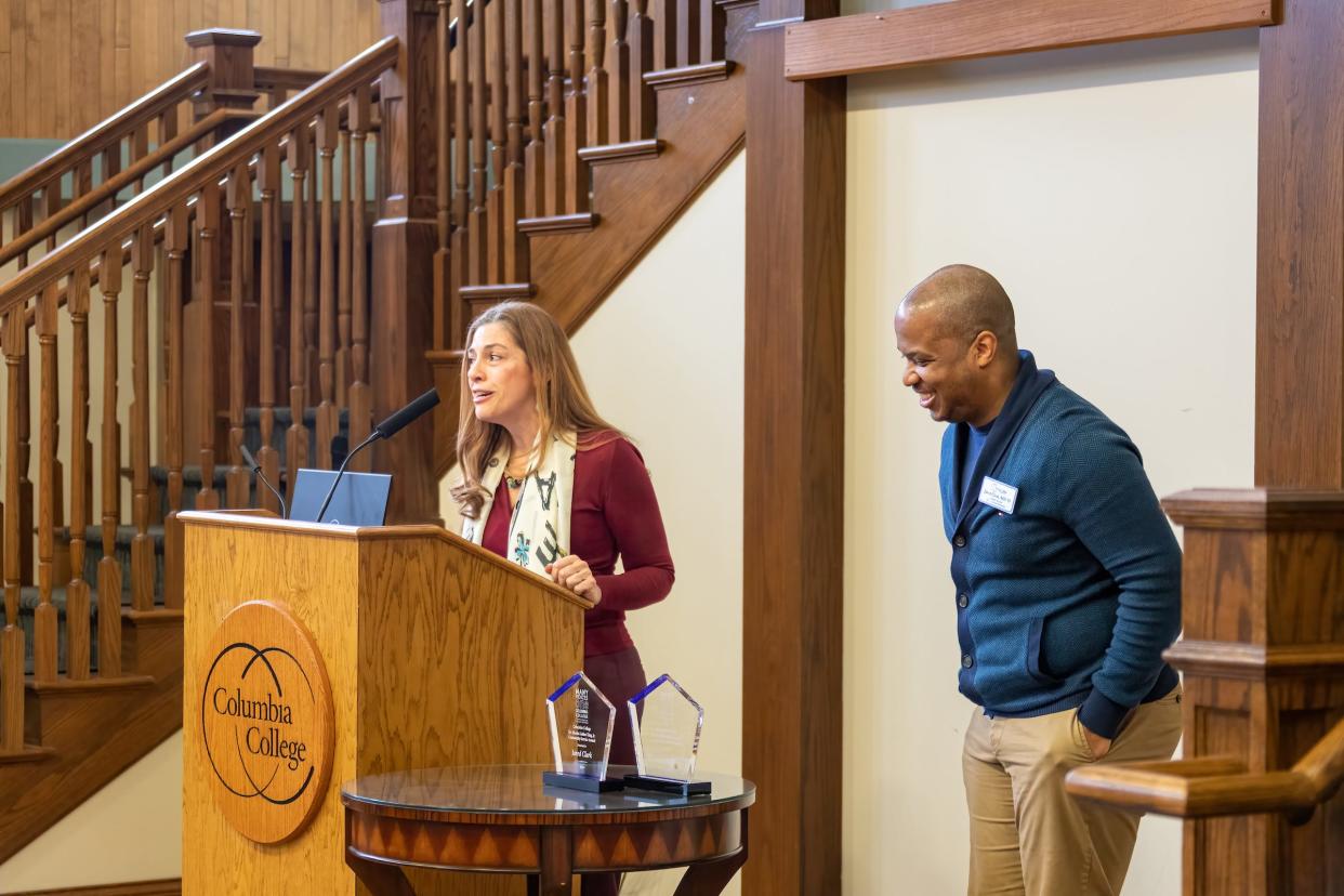 Columbia College Diversity Director Alejandra Gudino introduces Jared Clark, program specialist location operations for Columbia College Global, at the Martin Luther King Jr. Community Service Awards ceremony in Dorsey Hall on Tuesday.