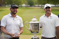 Michael Block, low club professional, and Brooks Koepka, winner, pose after the PGA Championship golf tournament at Oak Hill Country Club on Sunday, May 21, 2023, in Pittsford, N.Y.(AP Photo/Seth Wenig)
