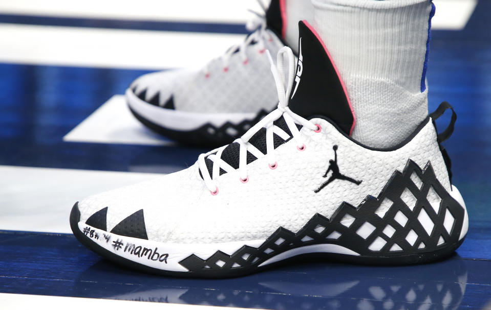 Dallas Mavericks guard Luka Doncic (77) wears shoes dedicated to Kobe Bryant as the Mavericks play the Phoenix Suns during the second half of an NBA basketball game Tuesday, Jan. 28, 2020, in Dallas. Phoenix won 133-104. (AP Photo/Ron Jenkins)