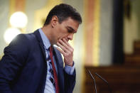 Spain's Prime Minister, Pedro Sanchez pauses during a speech at a parliamentary session in Madrid, Spain, Thursday, April 9, 2020. Sanchez acknowledged that Spain's government, and its regions which administer health services, were caught off guard by the crisis and left its hospitals woefully short on critical supplies, including coronavirus tests and protective clothing for medical workers. (Mariscal, Pool Photo via AP)