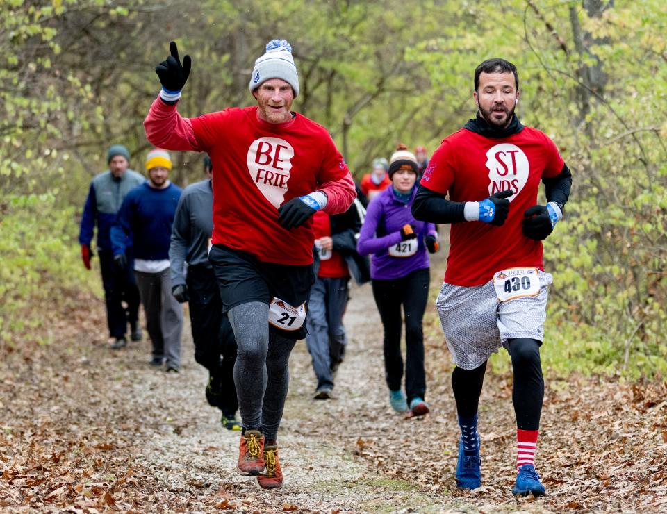 Best friends Adam Barber (21) and Chad Rinehart (430) make their way along the trail during the Living History Farms Race in 2022.
