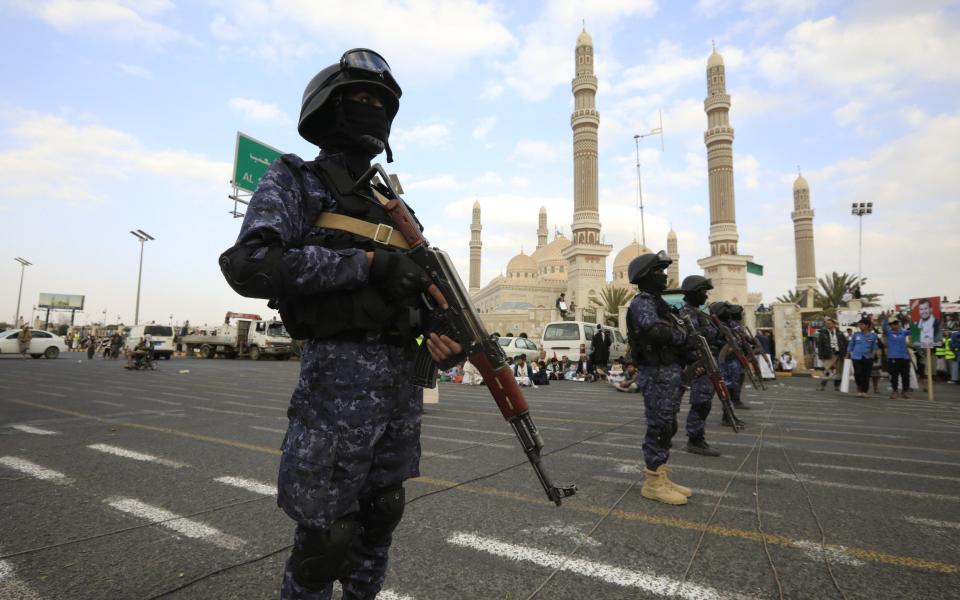 Houthi troops guard a pro-Palestinian protest in the Yemen capital