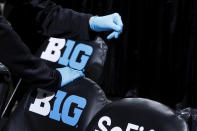 Trainers wear rubber gloves as they work in the bench area during the first round of the Big Ten Men's Basketball Tournament game between the Nebraska Cornhuskers and Indiana Hoosiers at Bankers Life Fieldhouse on March 11, 2020 in Indianapolis, Indiana. The Big Ten Conference announced that fans would not be allowed to attend the remainder of the tournament due to concerns over the COVID-19 virus. (Photo by Joe Robbins/Getty Images)