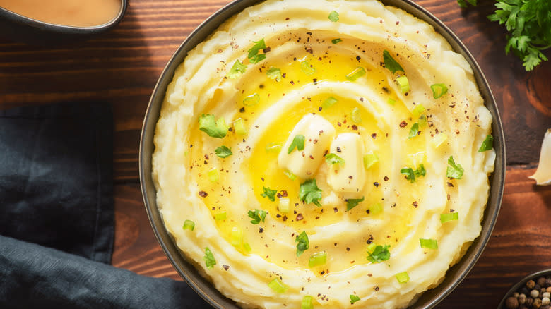 Bowl of mashed potatoes with butter and chives