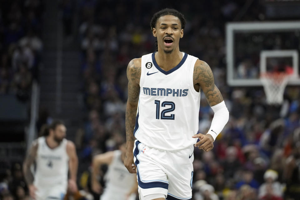 Memphis Grizzlies guard Ja Morant reacts after scoring against the Golden State Warriors during the first half of an NBA basketball game in San Francisco, Sunday, Dec. 25, 2022. (AP Photo/Godofredo A. Vásquez)