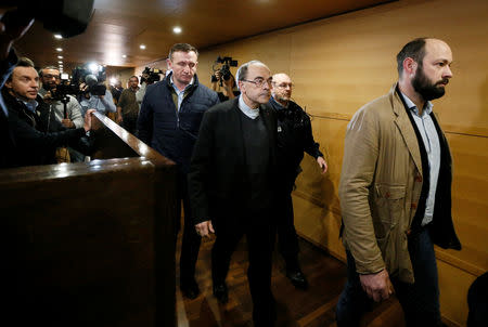 Cardinal Philippe Barbarin, Archbishop of Lyon, walks inside the courthouse during a break in his trial, charged with failing to act on historical allegations of sexual abuse of boy scouts by a priest in his diocese, at the courthouse in Lyon, France, January 7, 2019. REUTERS/Emmanuel Foudrot