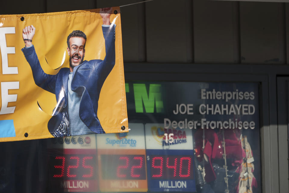 A sign for the estimated $940 million jackpot up for grabs is seen at Joe's Service Center, a Mobil gas station that sold the $2.04 billion-winning Powerball ticket award in Altadena, Calif., Friday, Jan. 6, 2023. Lottery players whose numbers didn't hit or who forgot to even buy a ticket will have another shot at a nearly $1 billion Mega Millions prize. The estimated $940 million jackpot up for grabs Friday night has been growing for more than two months and now ranks as the sixth-largest in U.S history. (AP Photo/Damian Dovarganes)