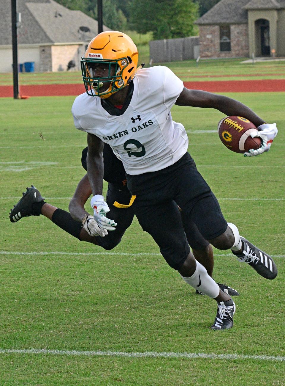 Green Oaks' DeColdest Crawford runs the ball against Northwood Friday at the Northwood Jamboree.
