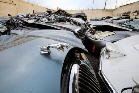 An emblem of a Jaguar is seen after it was destroyed together with other condemned smuggled luxury cars worth 61,626,000.00 pesos (approximately US$1.2 million), which include used Lexus, BMW, Mercedes-Benz, Audi, Jaguar and Corvette Stingray, during the 116th Bureau of Customs founding anniversary in Metro Manila, Philippines February 6, 2018. REUTERS/Romeo Ranoco