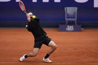 Taylor Fritz of the United States returns the ball during the final match against Jan-Lennard Struff of Germany at the Tennis ATP tournament in Munich, Germany, Sunday, April 21, 2024. (AP Photo/Matthias Schrader)
